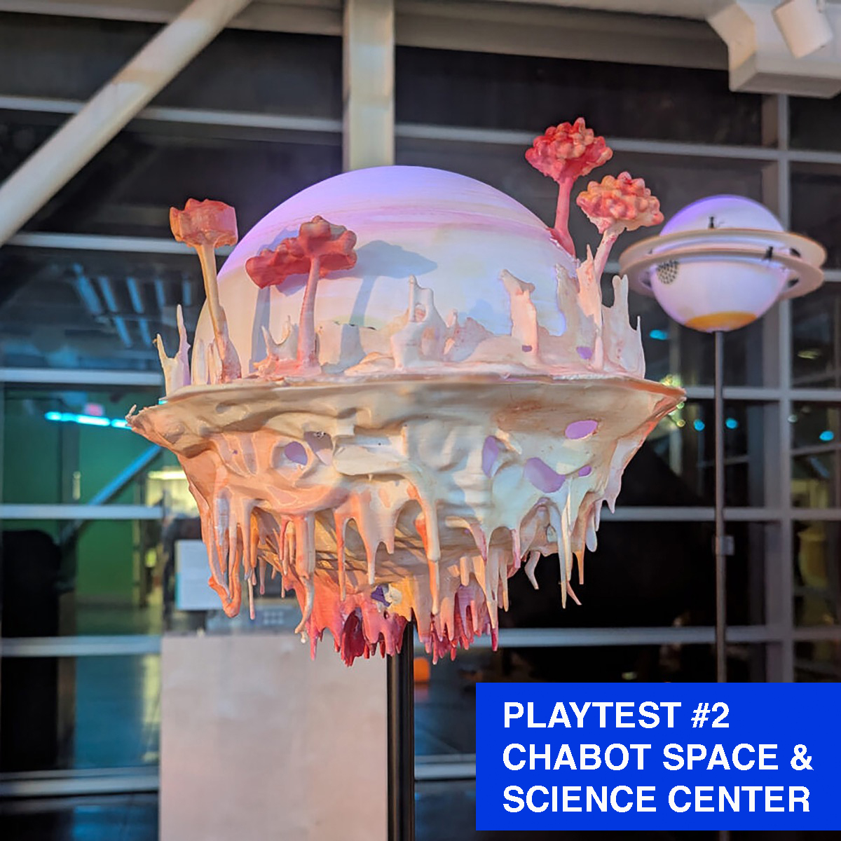 A planet sculpture that has drippy bits